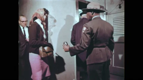 1960s: Tourists enter elevator at Statue of Liberty guided by Park Ranger. 90 스톡 동영상 196947906