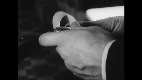 1960s: Train dining car, detective flips pages of notepad, puts in pocket, Stock Footage 121588979