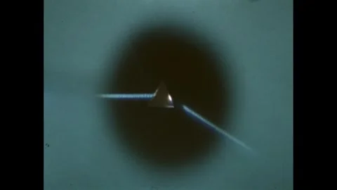 1960s: Triangular prism refracting a beam of light. Stock Footage 247158434