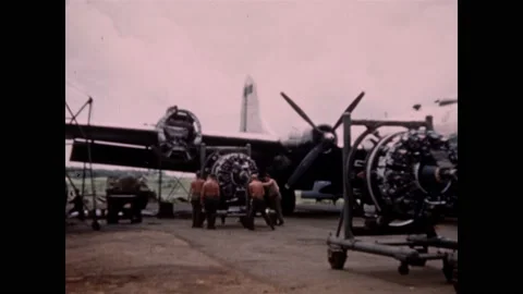 1960s: Two engines from bomber plane are hauled away on carts as two new engines Vídeo Stock 160169364