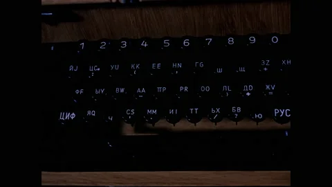 1960s: Typewriter keys in foreign language.  Office.  Teleprinter with sign.  Stock Footage 158448748