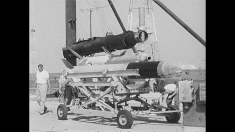 1960s: UNITED STATES: rocket testing of antennae systems. Rockets launched into Stock Footage 104727780