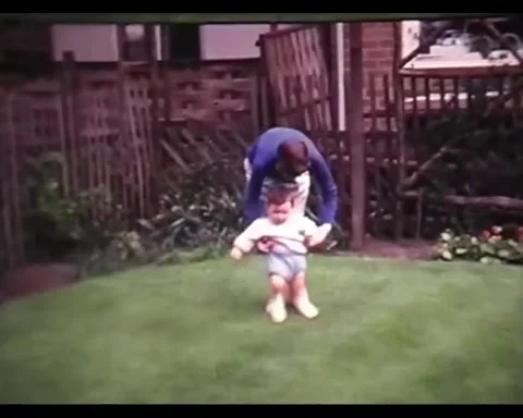 1960's Video - Baby learning to walk with Mother Stock Footage