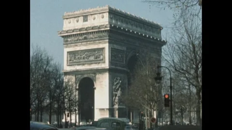 1960s: View of Arc De Triomphe from road and car Stock Footage 289157580
