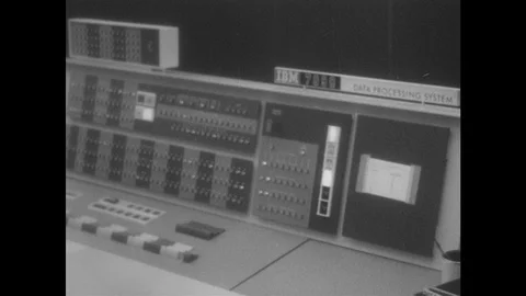 1960s: View of computer. Close up of computer panel. Paper feeding from printer. Stock Footage 94465516