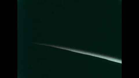 1960s: View of earth from space, sun appears from over horizon. Map of earth on Stock Footage 77409979