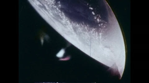 1960s: View of Earth from spacecraft / Front of boat crashes through waves / Stock Footage