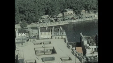 1960s: view of Paris rooftops and the Seine River from above, including the Stock Footage 289157932