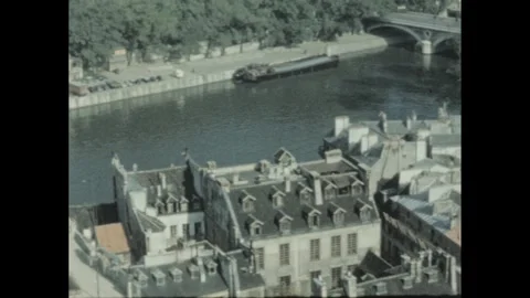 1960s: view of Paris rooftops and the Seine River from above, including the Stock Footage 289157939