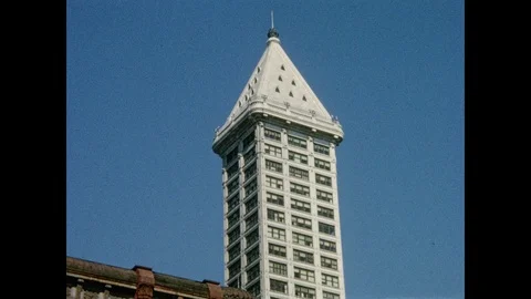 1960s: Views of Smith Tower, totem pole, in Pioneer Square, Seattle. Stock Footage 107157016