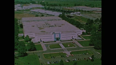 1960s: Workers adjusts knobs on monitors. Exterior lab building. Fighter jets in 스톡 동영상 159169761