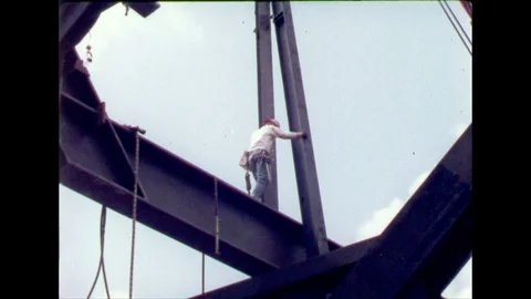 1960s: Workers construct infrastructure of pavilion building. Workers operate Stock Footage 112448094