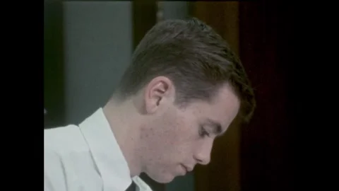 1960s: young man with acne leans, looks | Stock Video | Pond5