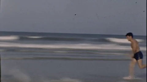 1960s Young Men Run on The THE BEACH Summer Vintage Old 8mm Film Home Movie Vídeos de archivo 80276599