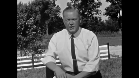 1961 - After a swine farmer speaks, hogs are driven off in a truck to be Stock Footage