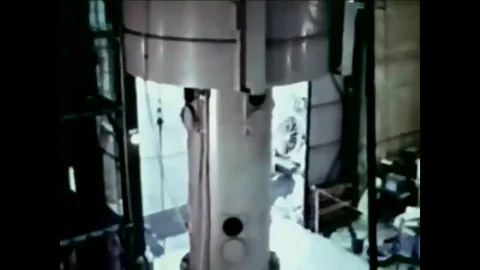 1961 - Components of a sodium reactor are manipulated. Modifications are made to Stock Footage 103269976