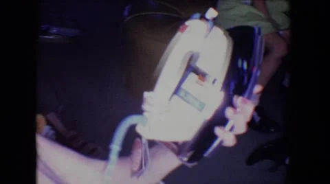 1961: grandma gets an iron at family gathering SALTON SEA, CALIFORNIA Stock Footage