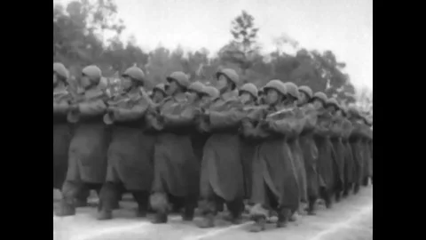 1961 - Korean War scenes with hundreds of retreating soldiers in a wintery Stock Footage