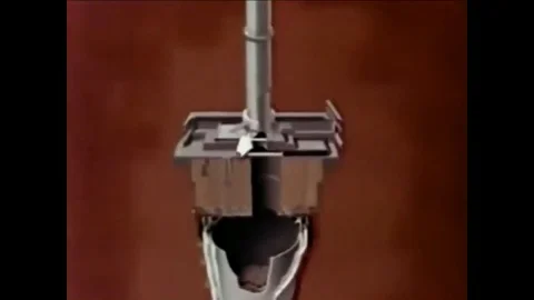 1961 - Moderator cans are extracted and replaced in a sodium reactor. Stock Footage 103269911