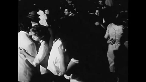 1961 - A party is thrown for the teenage members of the interracial Youth for Stock Footage