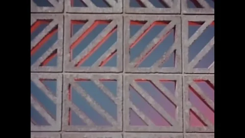 1961 - A presenter on a stage shows building materials including split block Stock Footage 82803197