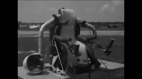 1961 - Test engineer Harold M Graham gets strapped into a flying rocket belt. Stock Footage 232894650