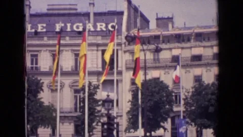 1962: bunch of flags hoisted in straight line in front of le figaro PARIS FRANCE Stock Footage 72525470