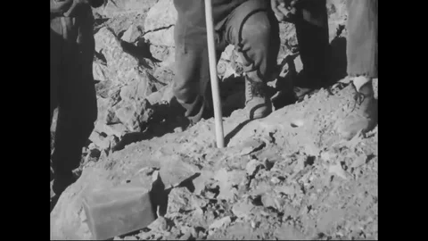 1962 - The Iranian army explodes dynamite in the side of a hill and begins Stock Footage 123874122