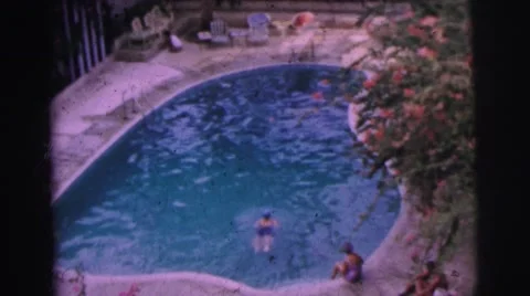 1962: lady in swim cap swimming across pool BANGKOK Stock Footage