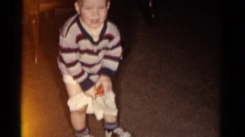 1962: little boy trying to pull up his p... | Stock Video | Pond5