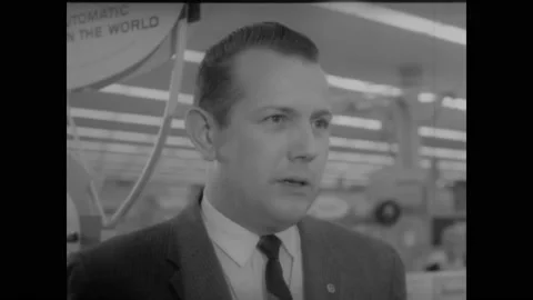 1962 - The manager of a Sears explains the store's warranty and service policy. Stock Footage 221859880