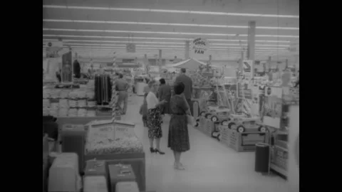 1962 - The manager of a Sears explains why he plays music in the store for Stock Footage 221863492