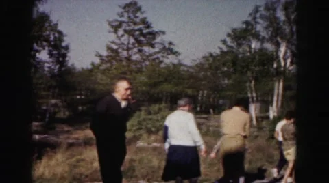 1962: people walking about what appears to be a historic site made of stone Stock Footage