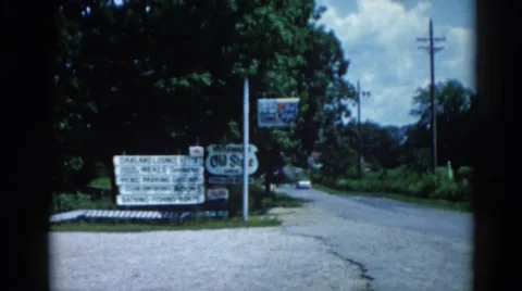 1962: a road is seen having flags along CHICAGOLAND AREA Stock Footage