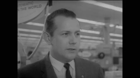 1962 - A Sears manager explains the concept of buying things on credit. Stock Footage 221860906