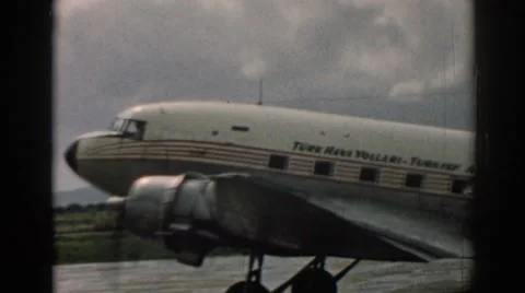 1962: Small Aircraft with U.S. Flag Pattern Moving Slowly on Runway in Izmir, Stock Footage 68798329