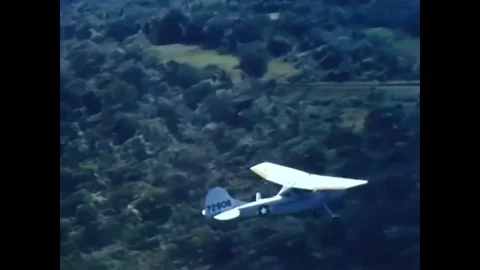 1963, 1964 A US Air Force plane flies over a US base in Vietnam, and Vietnamese Vídeos de archivo 83615133