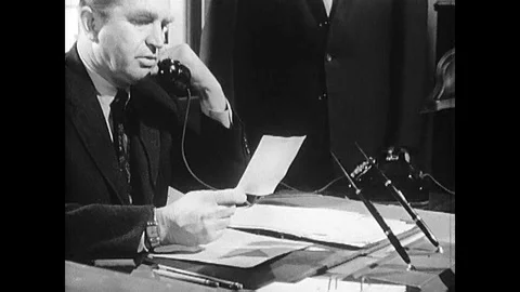 1963 - An agent of the US State Department make a call to send a coded message Stock Footage 143856066