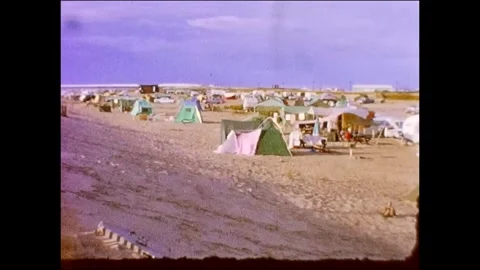 1963 Cape Hatteras Camping old cars and tents on beach Stock Footage 336739454