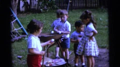1963: children are seen having fun in a garden area CAMDEN, NEW JERSEY Stock Footage