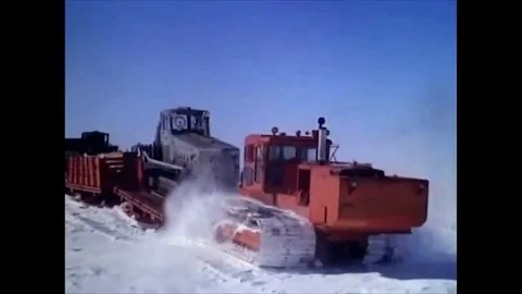 1963 A convoy of sleds pulls supplies, and a helicopter and Polecats arrive at Stock Footage 115374821