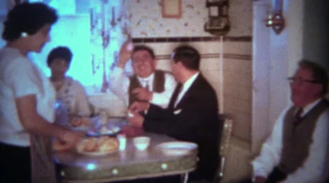 1963: Easter Eggs Passed Around During Holiday Kitchen Dining Event. BUFFALO, Vídeos de archivo 58671407