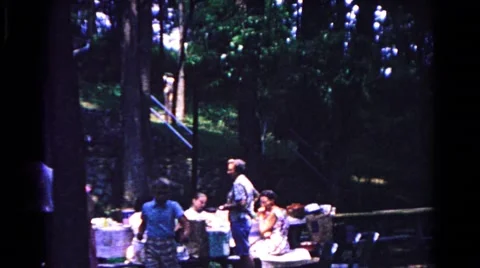 1963: enjoying a meal on a holiday with the family in the countryside Stock Footage