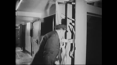 1963 - A guard uses a device to open prison cell doors at the abandoned Stock Footage 238773328