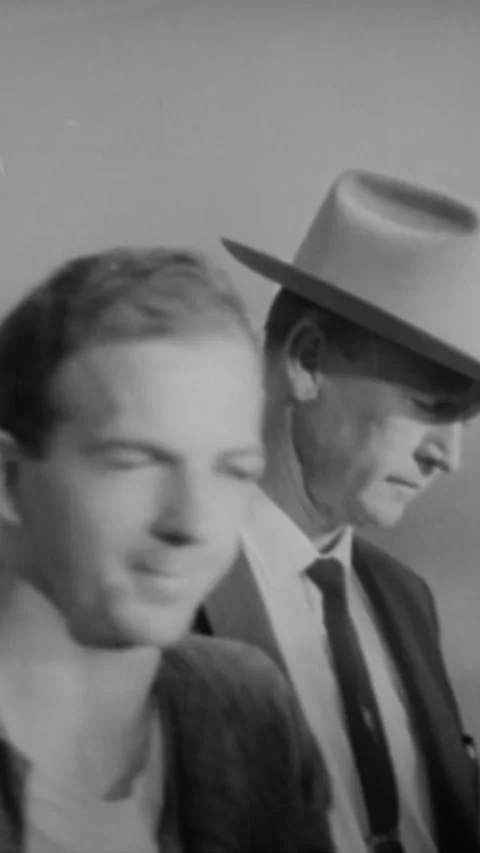 1963 - Jack Ruby shoots JFK's assassin Lee Harvey Oswald as he is being escorted Stock Footage 284131565