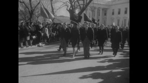 1963 - Jackie, Robert, and Ted Kennedy lead the funeral procession bringing Stock Footage 134551792