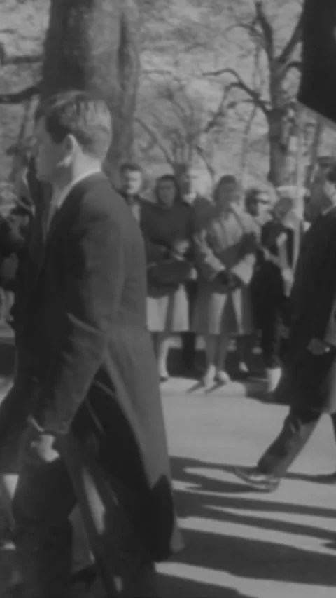 1963 - Jackie, Robert, and Ted Kennedy lead the funeral procession bringing Stock Footage 284134340