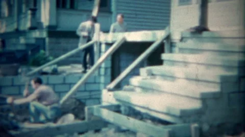 1963: Man Using Sledgehammer Remodeling Home Garage Construction in Buffalo, New Stock Footage 58685440