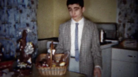 1963: Siblings Opening Easter Baskets with Chocolate Bunny Rabbits in Buffalo, Stock Footage 58685460