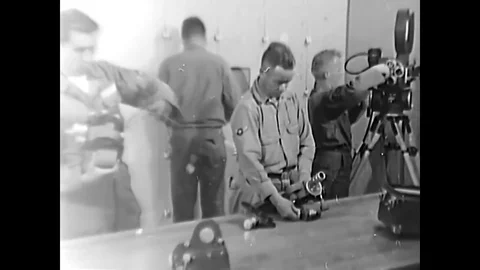 1963 - United States Air Force cameraman prepare camera equipment in the Stock Footage